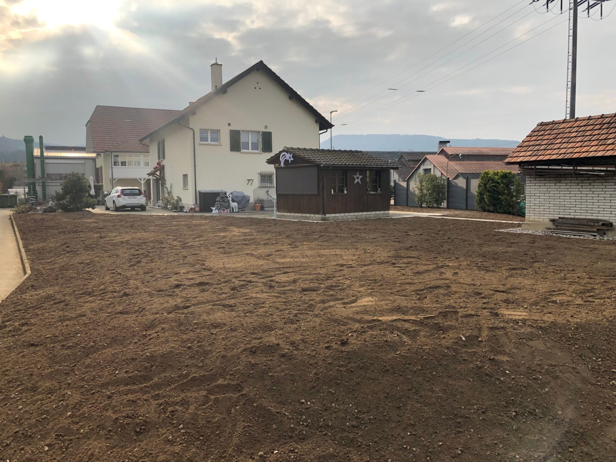 Einfamilienhaus Garten Erde.jpg